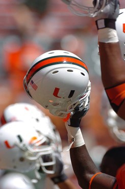 University of Miami players raise their helmets to salute fans for their support before a game against Marshall University on September 1, 2007 at the...