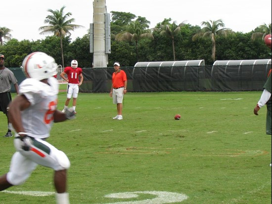 Wide receiver Ben Bruneau awaits a pass from quarterback Ryan Williams as offensive coordinator Jedd Fisch looks on.
