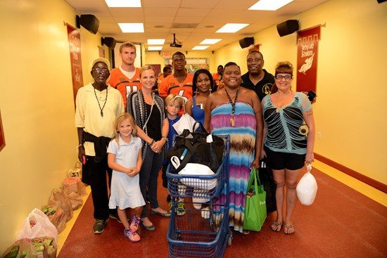 Players and coaches' wives took photos with several families Tuesday afternoon