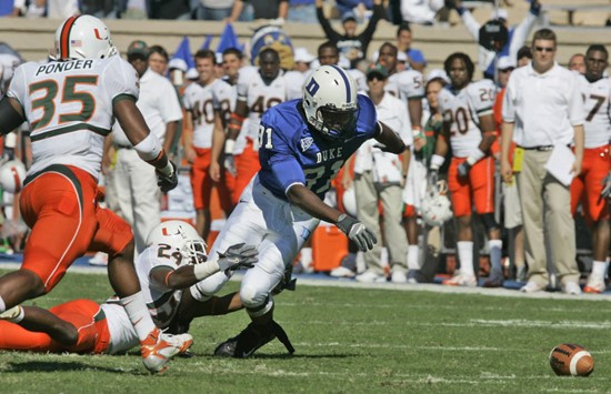 Duke's Jomar Wright (81) fumbles the ball as Miami's Lovon Ponder (35) goes in for the recovery during the first half of a football game in Durham,...