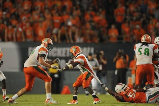 University of Miami Hurricanes linebacker Marcus Robinson #56 makes a one handed tackle in a game against the Florida A&amp;M Rattlers at Sun Life...