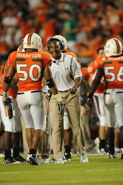 University of Miami Hurricanes head coach Randy Shannon gives encouragement to linebacker Darryl Sharpton #50 in a game against the Oklahoma Sooners...