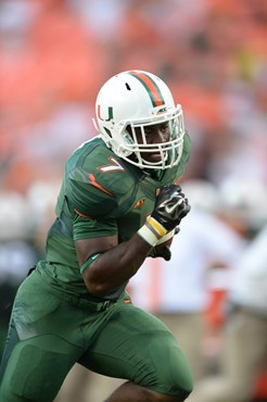 University of Miami Hurricanes running back Gus Edwards #7 scores a touchdown at the end of the first half in a game against the Arkansas State Red...