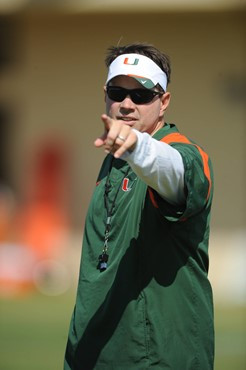 University of Miami Head Coach, Al Golden, instructs his team on how he wants them to execute his game plan during a spring practice at Greentree...