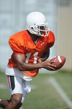 University of Miami Hurricanes quarterback Alonzo Highsmith #11 gets set to hand off the ball at Greentree Practice Field on August 13 in afternoon...