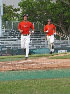 Yasmani Grandal (L) and Ryan Perry (R) at the Orange-Green World Series Wednesday afternoon at Alex Rodriguez Park.