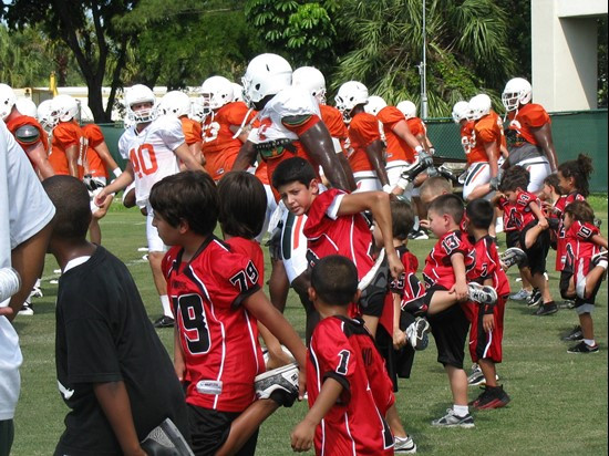 The Kendall Hammocks stretch with the Mimai Football Team during training camp
