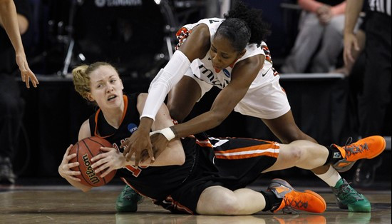 Idaho State's Kara Jenkins, left, tries to control the ball against Miami's Shenise Johnson during the first half of an NCAA tournament first-round...