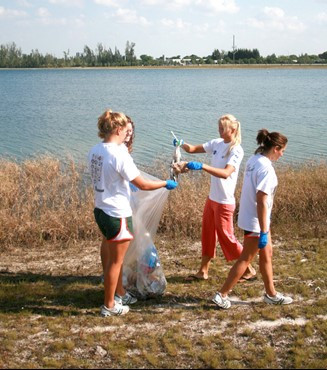 UM Staff, Coaches & Student Athletes volunteer at Amelia Earhart Park Community Service Project.