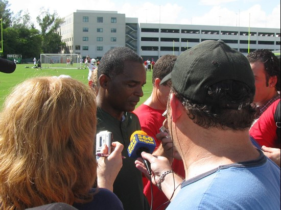 Talking with the press.