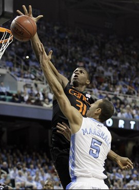 Miami's DeQuan Jones (31) blocks a shot by North Carolina's Kendall Marshall (5) in the first half of an NCAA college basketball game at the Atlantic...