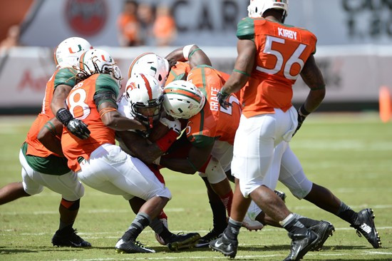 University of Miami Hurricanes linebacker Jermaine Grace #5 plays in a game against the Cincinnati Bearcats at Sun Life Stadium on October 11, 2014. ...