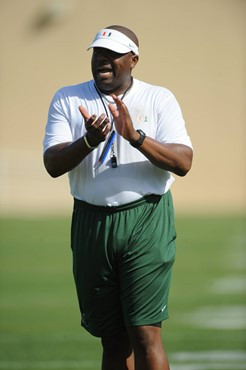 University of Miami Defenisve Line Coach, Jethro Franklin, instructs his team on how he wants them to execute his game plan during a spring practice...