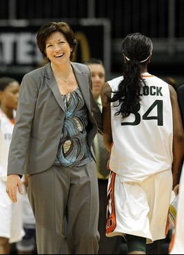 Miami coach Katie Meier congratulates Sylvia Bullock following an NCAA college basketball game against Clemson on Sunday, Feb. 5, 2012, in Coral...