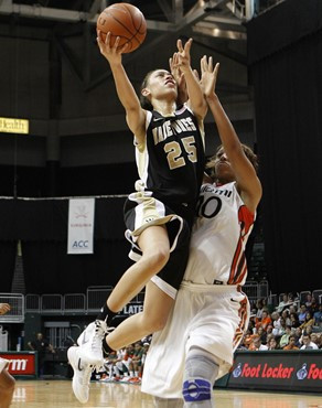 Wake Forest's Dearica Hamby (25) shoots over Miami's Shawnice Wilson. (AP Photo/Lynne Sladky)