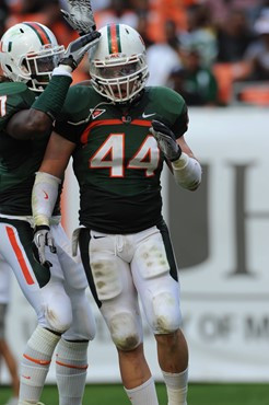 University of Miami Hurricanes linebacker Colin McCarthy #44 plays in a game against the University of South Florida Bulls at Sun Life Stadium on...