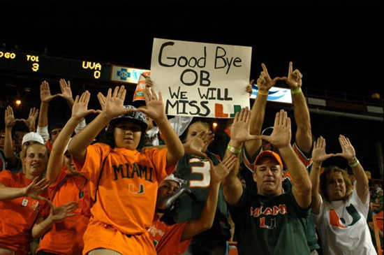 University of Miami Hurricane fans pose for a photograph and say goodbye to the Orange Bowl as the Miami Hurricanes play the Virginia Cavaliers in the...