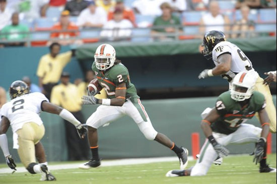 University of Miami Hurricanes running back Graig Cooper #2 rushes in a game against the Deamon Deacons of Wake Forest at Dolphin Stadium on October...