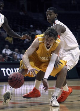 Valparaiso's Ryan Broekhoff (45) and Miami's Rion Brown (15) battle for control of the ball during the first half. (AP Photo/J Pat Carter)