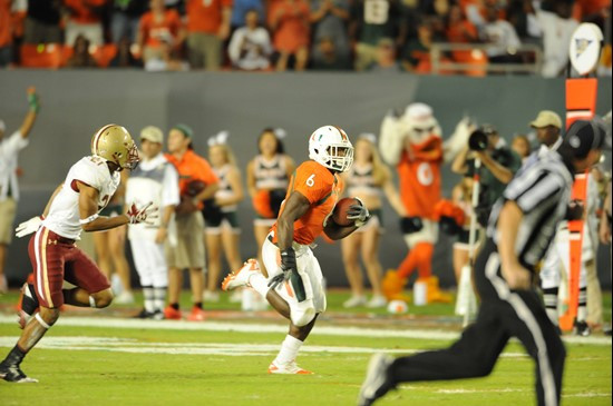 University of Miami Hurricanes running back Lamar Miller #6 carries the ball against the Boston College Eagles at Sun Life Stadium on November 25,...