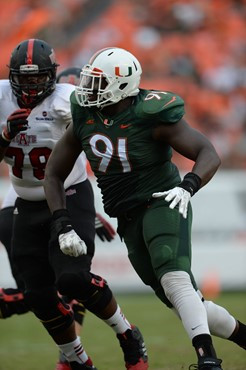 University of Miami Hurricanes defensive lineman Olsen Pierre #91 plays in a game against the Arkansas State Red Wolves at Sun Life Stadium on...