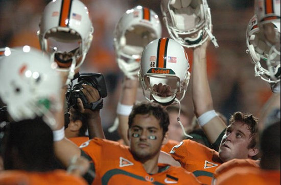 University of Miami players salute the crowd with their helmets before a game against the Virginia Cavaliers at the Orange Bowl on November 10, 2007. ...