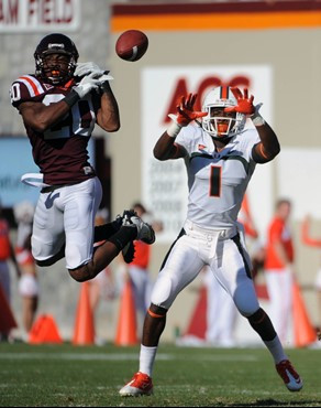 Virginia Tech's Jayron Hosley (20) breaks up a pass against Miami's Allen Hurns (1) during the first half of an NCAA college football game Saturday,...