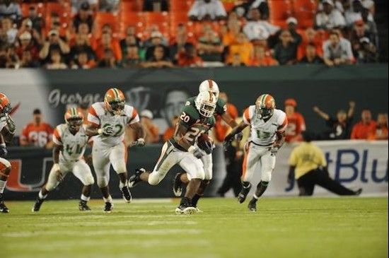 University of Miami Hurricanes running back Damien Berry #20 breaks tackles and makes a long run in a game against the Florida A&M Rattlers at Land...