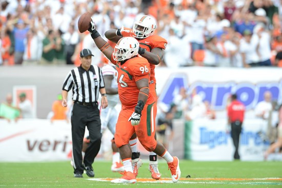 University of Miami Hurricanes defensive lineman Curtis Porter #96 plays in a game against the #12 ranked University of Florida Gators at Sun Life...