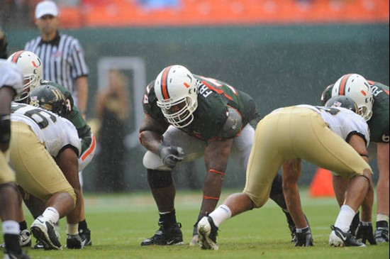 University of Miami Hurricanes offensive lineman Orlando Franklin #74 gets set to block against the Deamon Deacons of Wake Forest at Dolphin Stadium...