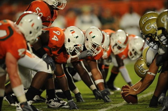 The University of Miami Hurricanes defensive line ready for battle against the Georgia Tech Yellow Jackets at the Land Shark Stadium on September 17,...