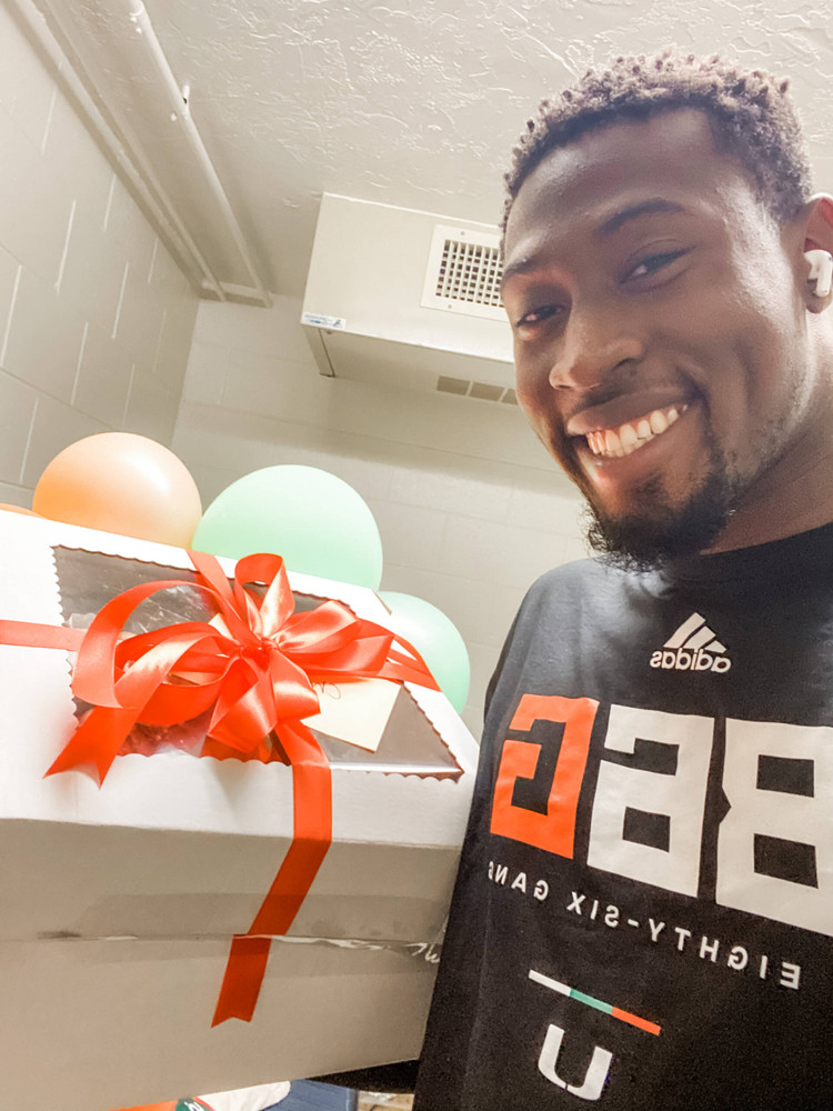 Hurricanes defensive end Chantz Williams with treats baked by Marianne Stroud, the wife of defensive line coach Todd Stroud.