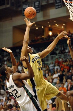 Georgia Tech forward Jeremis, right, Smith drives past University of Miami guard Brian Asbury during the second half Sunday, Dec 3, 2006, at the...