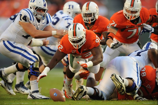 University of Miami Hurricanes defensive lineman Jalen Grimble #92 tries to recover a fumble against the Duke Blue Devils at Sun Life Stadium on...