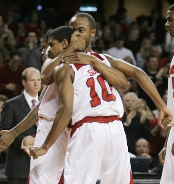 Louisville freshmen Edgar Sosa (10) and Jerry Smith hug after going out to a big lead in the second half of their basketball game against Miami in...