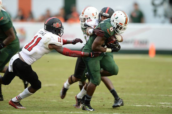 University of Miami Hurricanes running back Duke Johnson #8 plays in a game against the Arkansas State Red Wolves at Sun Life Stadium on September13,...