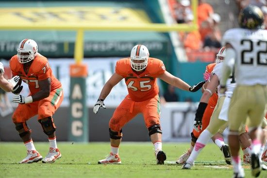 University of Miami Hurricanes offensive lineman Brandon Linder #65 gets set to block in a game against the Wake Forest Demon Deacons at Sun Life...