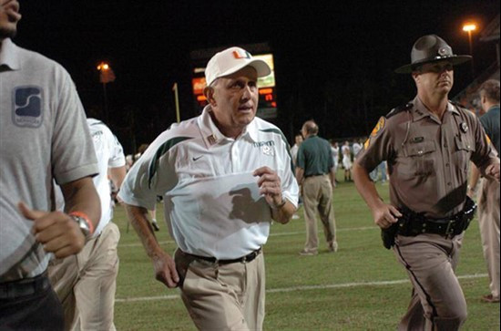 University of Miami Hurricanes head coach Larry Coker leads his team off the field after a game against the Virginia Tech Hokies at the orange Bowl on...