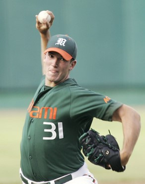 Miami starting pitcher Enrique Garcia delivers against Stanford in the first inning of an NCAA College World Series baseball game in Omaha, Neb.,...