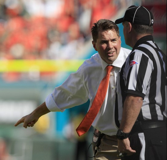 Miami head coach Al Golden argues a call with line judge Tommy Giles during first half against Georgia Tech. (AP Photo/Wilfredo Lee)