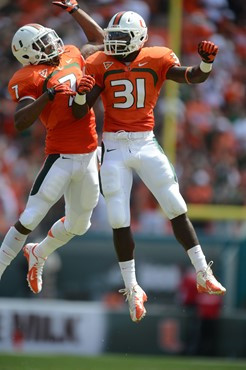 University of Miami Hurricanes defensive back Vaughn Telemaque #7 and Tyrone Cornileus #31 celebrate in a game against the North Carolina State...