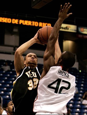 Raymond Hicks blocks a shot attempt of VCU's Myk Brown. (AP Photo/Andres Leighton)