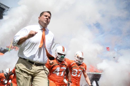University of Miami Hurricanes head coach Al Golden leads his team on the field in a game against the Wake Forest Demon Deacons at Sun Life Stadium on...