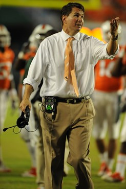 University of Miami Hurricanes head coach Al Golden leads his team on the field in a game against the Boston College Eagles at Sun Life Stadium on...