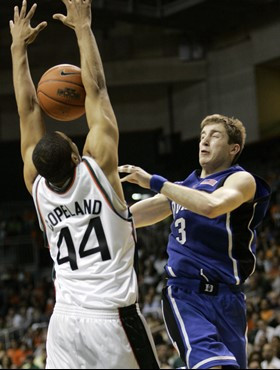 Miami's Keaton Copeland (44) blocks a pass by Duke's Greg Paulus (3) in the second half of a basketball game in Coral Gables, Fla., Sunday, Jan. 14,...