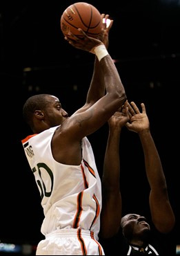 Anthony King goes up for a shot as VCU's Wil Fameni defends during the first half in San Juan, Friday. (AP Photo/Andres Leighton)