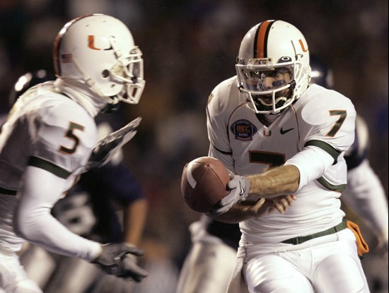 Miami quarterback Kirby Freeman hands off to running back Javarris James during the first quarter against Nevada in the MPC Computers Bowl. (AP...