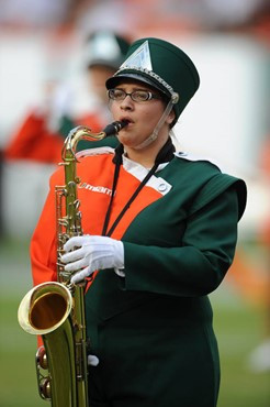 A University of Miami Band of the Hour participant entertains the crowd in a game against the University of Central Florida Knights at Dolphin Stadium...