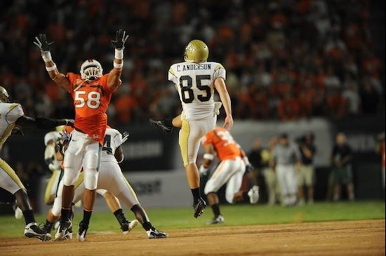 University of Miami Hurricanes linebacker Jordan Futch #58 nearly blocks a punt in a game against the Georgia Tech Yellow Jackets at Land Shark...