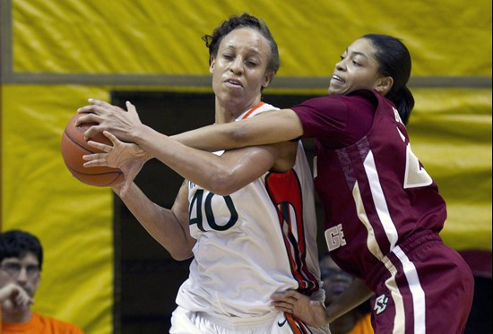 Boston College's Shayra Brown, right, tries to steal the ball from Miami's Shawnice Wilson (40) during the first half of an NCAA women's college...
